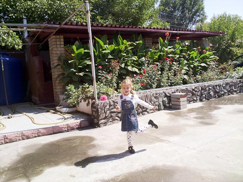 Playing in the yard.  Need to get some pics of the house and yard, I guess.